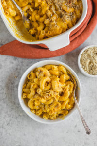 baked vegan mac and cheese in small white bowl