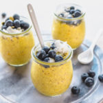 golden milk chia pudding jars with blueberries and coconut