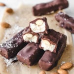 stack of almond joy bars on parchment paper