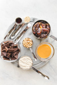 Ingredients for snickers bars on marble cutting board