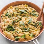 One Pot Spinach Artichoke Pasta in red pan