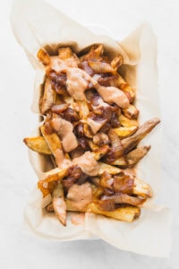 Vegan Animal Style Fries with Special Sauce in white container