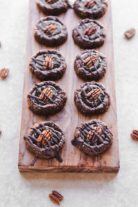 Chocolate Turtle Cookies on wood cutting board
