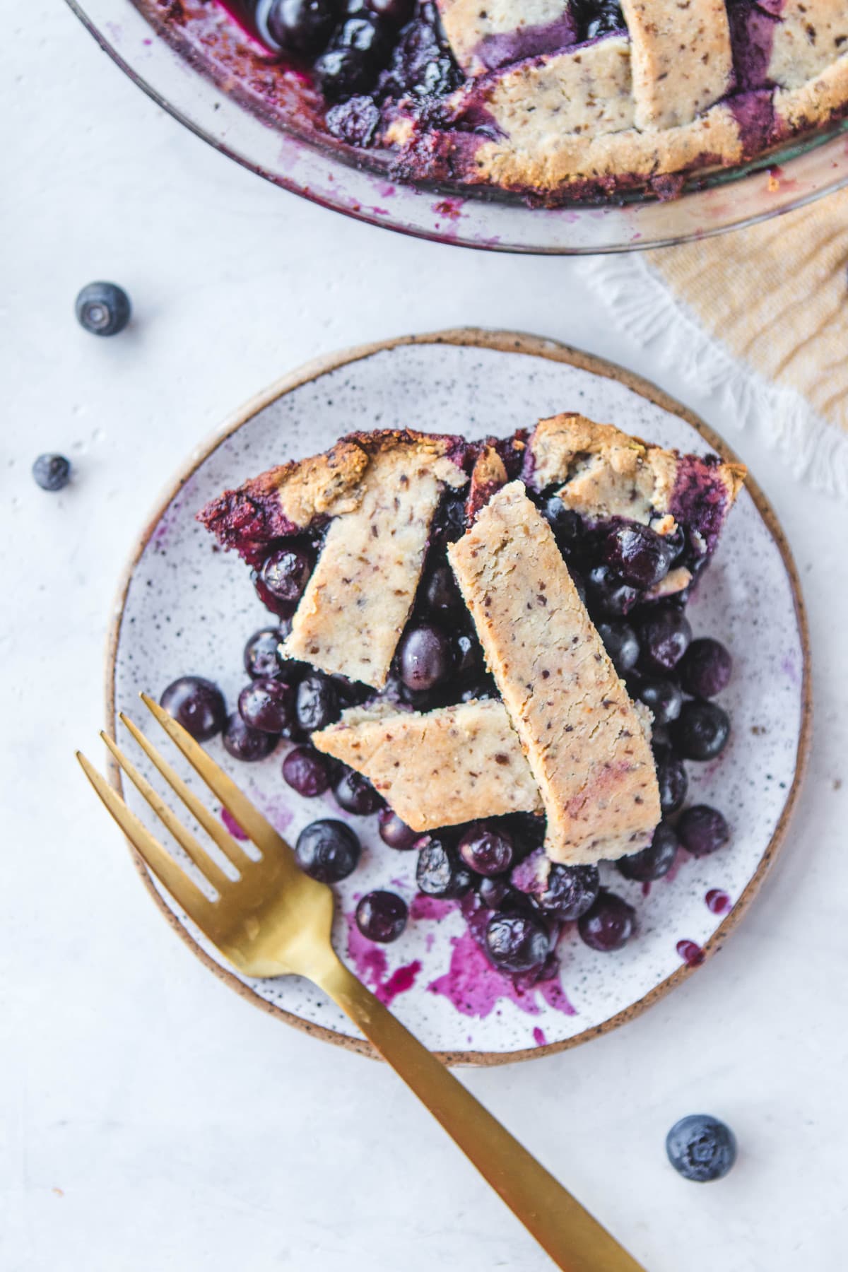 A Vegan Blueberry Pie that is refined sugar free, grain free, gluten free, and tasty! #blueberrypie #plantbased #vegan #blueberry #veganpie #pie #grainfree #healthydessert #dessert #oilfree via frommybowl.com