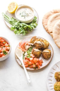 falafel with tahini sauce and chopped tomatoes
