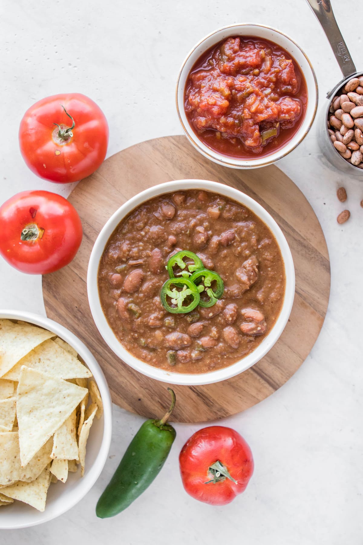 bowl of refried beans on wooden board
