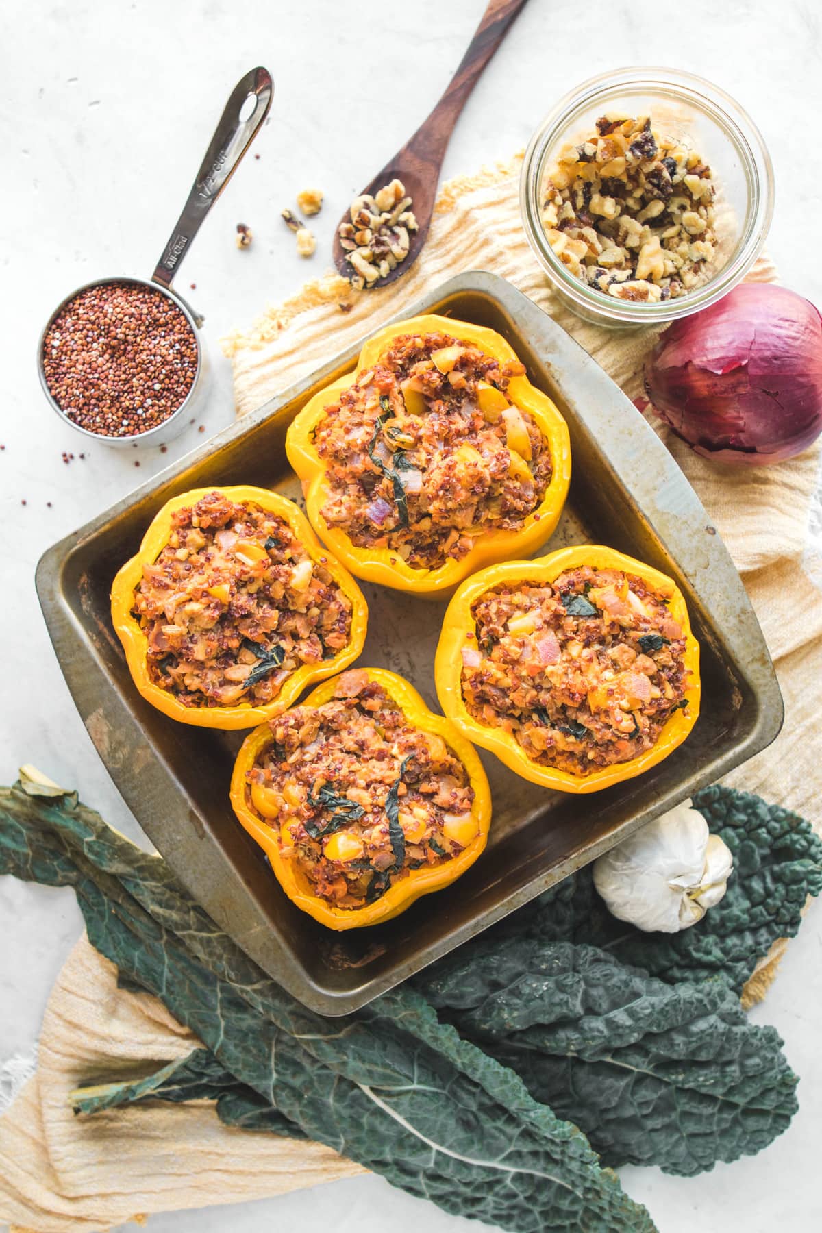 kale and quinoa vegan stuffed peppers in baking dish