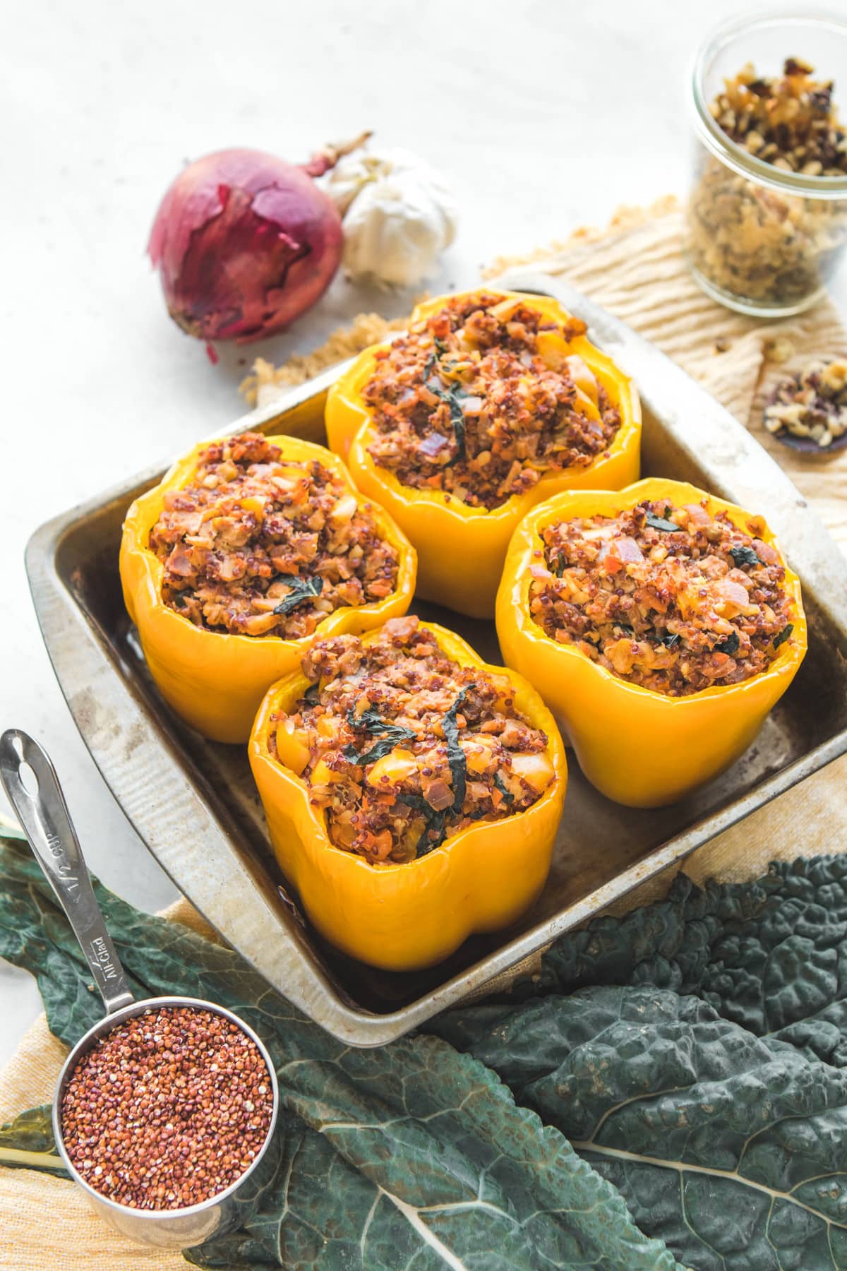 kale and quinoa vegan stuffed peppers in baking tray