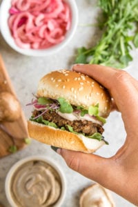 hand holding mushroom veggie burger