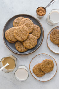 gray plate with tahini sugar cookies and white plate with cookies on top