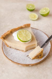 slice of key lime pie with piece on a fork