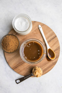 salted caramel sauce in glass jar with ingredients
