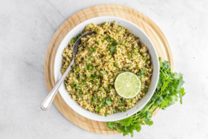cilantro lime rice in white bowl with spoon