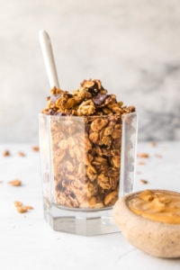 Vegan, Gluten Free, and Refined Sugar-Free, this Peanut Butter Cup Granola tastes just like dessert, but is full of healthy and wholesome ingredients! Vegan, Gluten Free, Refined Sugar-Free. #vegan #plantbased #glutenfree #refinedsugarfree #oilfree #granola #breakfast #mealprep #peanutbutter #peanutbuttercup #chocolategranola #healthybreakfast #onthego #healthysnack via frommybowl.com