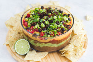 glass bowl of seven layer dip