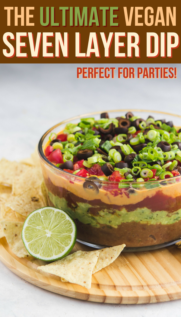 This Vegan Seven Layer Dip is made of layers of Refried Beans, Guacamole, Queso, and more...making it a perfect appetizer or party treat! Gluten Free & Oil Free #vegan #plantbased #dip #partydip #healthyappetizer #appetizer #sevenlayerdip #refriedbeans #guacamole #glutenfree #gameday #potluck via frommybowl.com