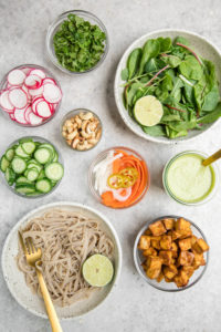 prepared ingredients for banh mi buddha bowls on marble backdrop
