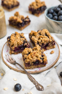 blueberry crumble bars on white plate