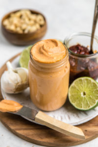 chipotle lime mayo in glass jar with ingredients in background
