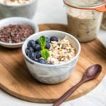 bowl of muesli with blueberries and fresh mint