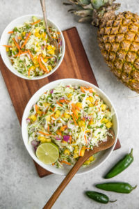 overhead shot of pineapple coleslaw with jalapenos and pineapple