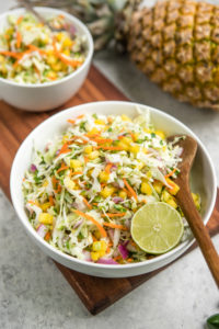 white bowl of pineapple coleslaw with lime