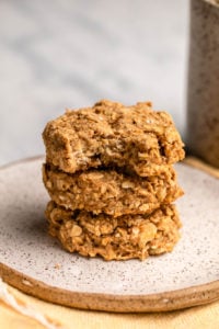 stack of banana oatmeal breakfast cookies on white speckled plate