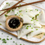 vegan mushroom dumplings on white serving platter