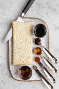 ingredients for smoky tempeh and block of tempeh on white serving tray