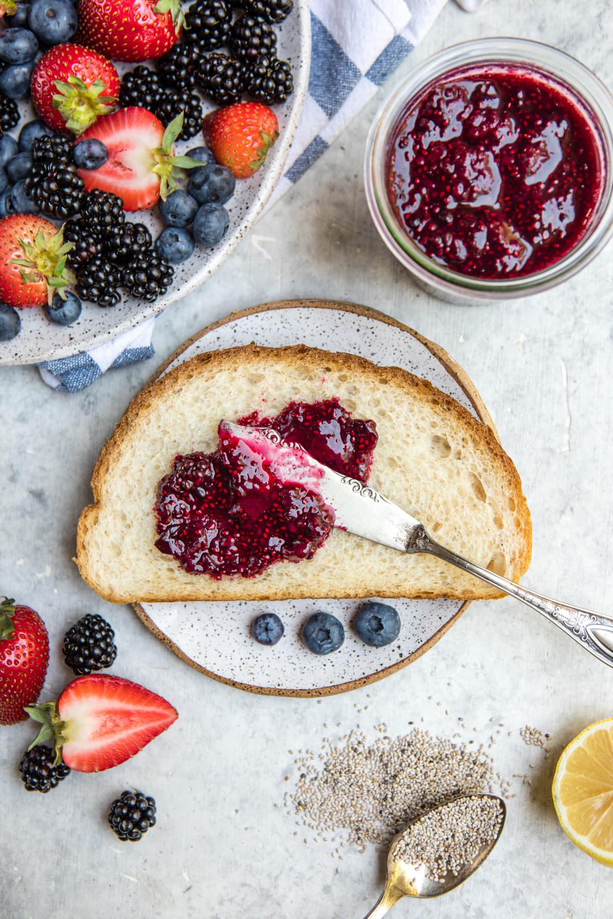 spread of fresh berries and toast with chia seed jam