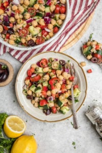 white bowl of chickpea salad on grey marble background