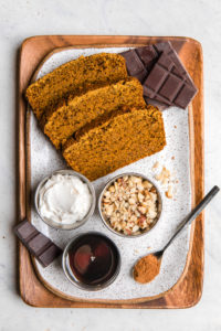 ingredients for pumpkin spice cake pops on white serving tray