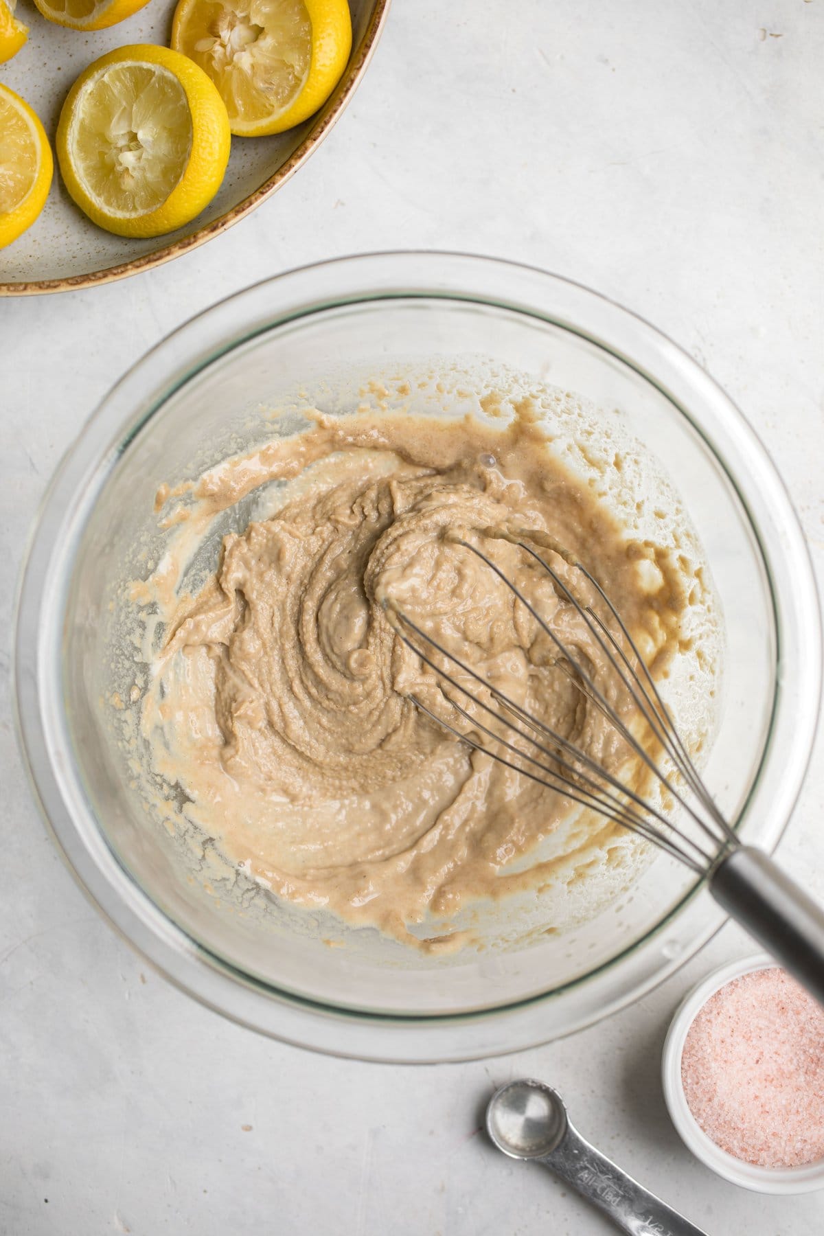 thickened tahini dressing in glass bowl