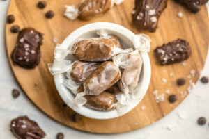 white bowl filled with date sweetened salted caramels