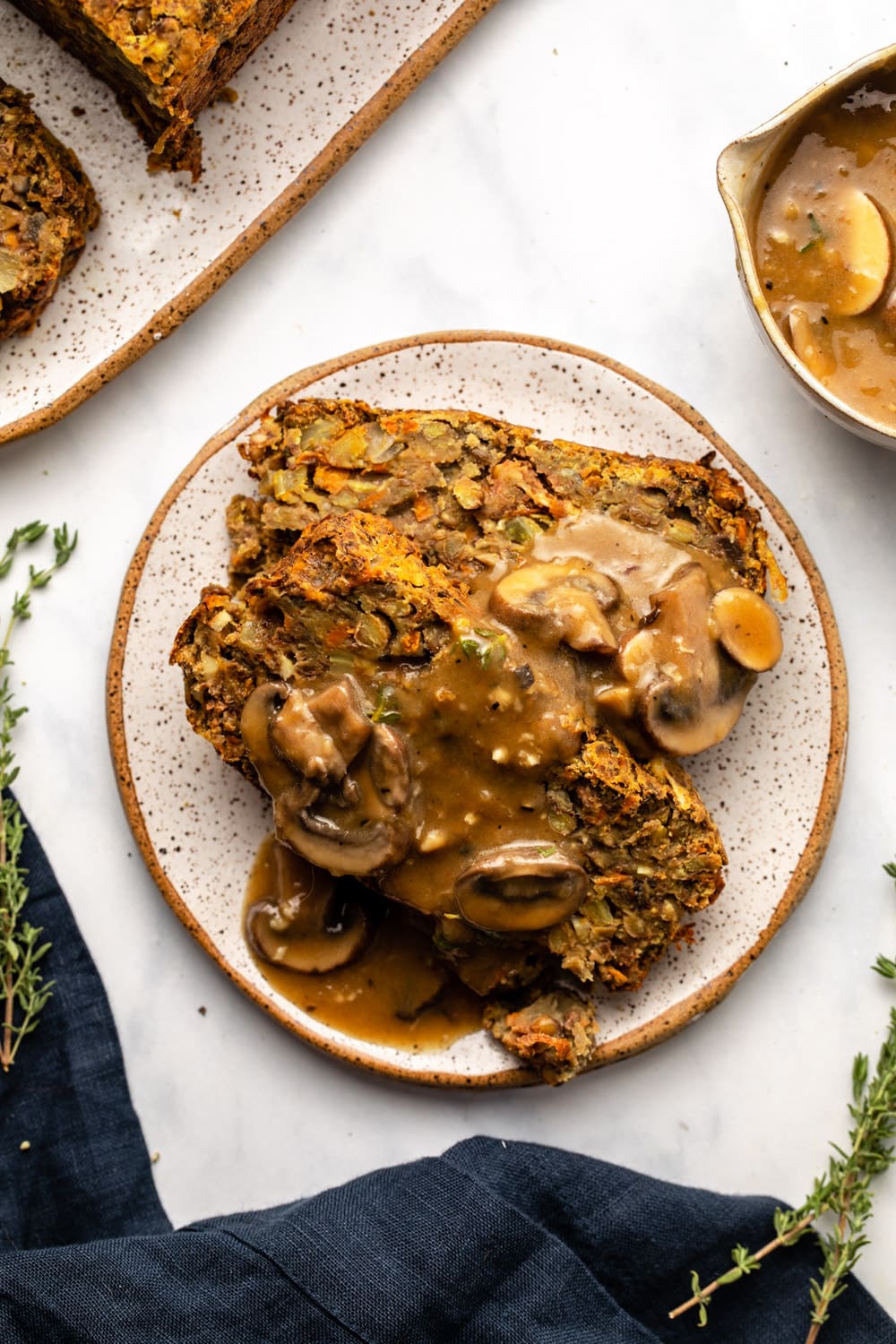 two slices of lentil loaf topped with gravy