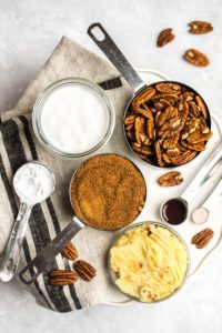 ingredients for pecan pie on marble cutting board