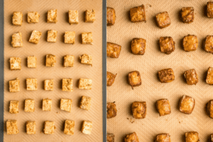 side by side photos of unbaked and baked tofu cubes on silicone mat