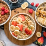 three white bowls of oatmeal topped with various toppings