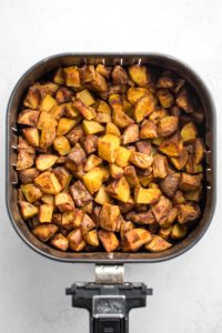 crispy potatoes in air fryer basket