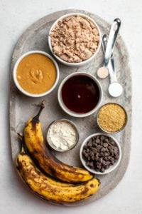 ingredients for banana pulp cookies on grey marble serving tray