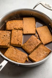 braised tofu in metal pot after baking