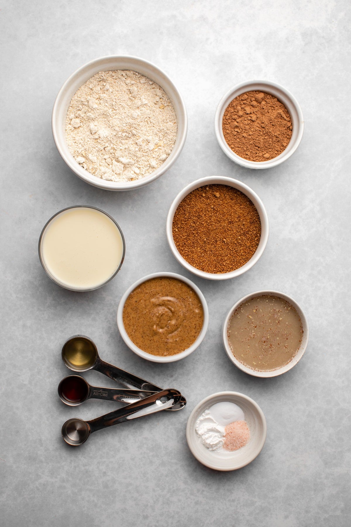 ingredients for chocolate cherry cake mix in small white bowls