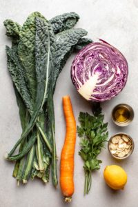 ingredients for everyday kale salad on grey background