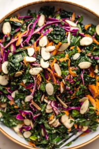 close up photo of details of everyday kale salad in white bowl
