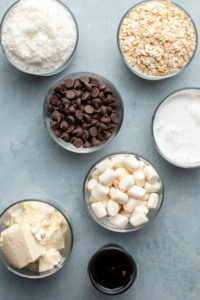 ingredients for smores bars in small glass bowls
