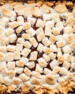 close up photo of golden marshmallows of vegan smores bars
