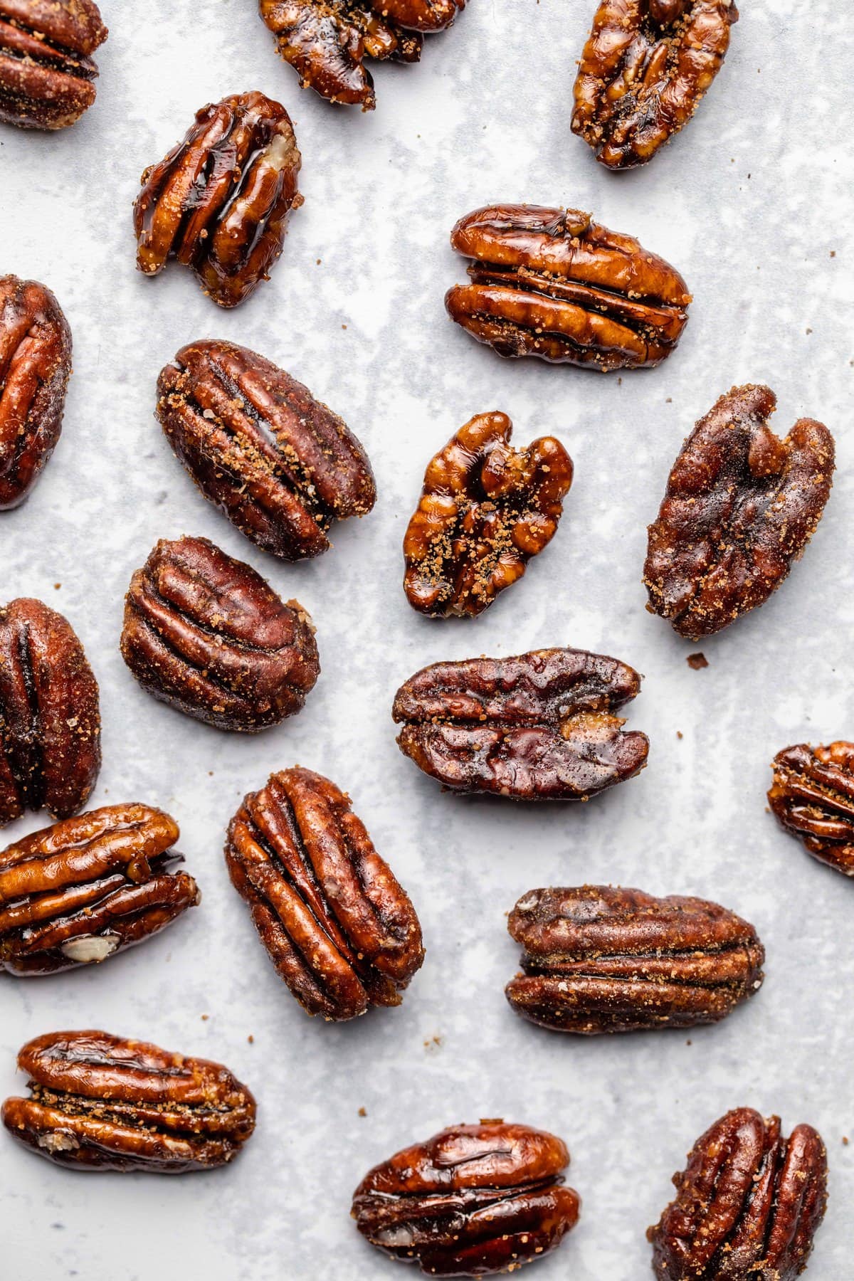 candied pecans on white marble packground