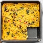 vegan breakfast casserole in gray baking tray on marble background
