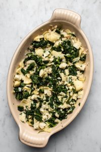 spinach, artichokes, and garlic in baking dish