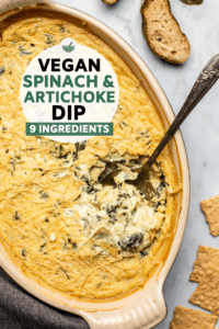 This baked vegan Spinach & Artichoke dip is cheesy, creamy, and SO easy! Made from only 9 simple, affordable, and accessible ingredients. #vegan #spinach #artichoke #dip #plantbased | frommybowl.com